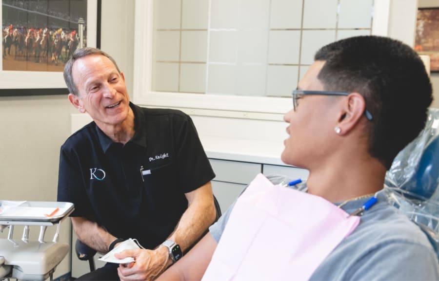 teen smiling with doctor