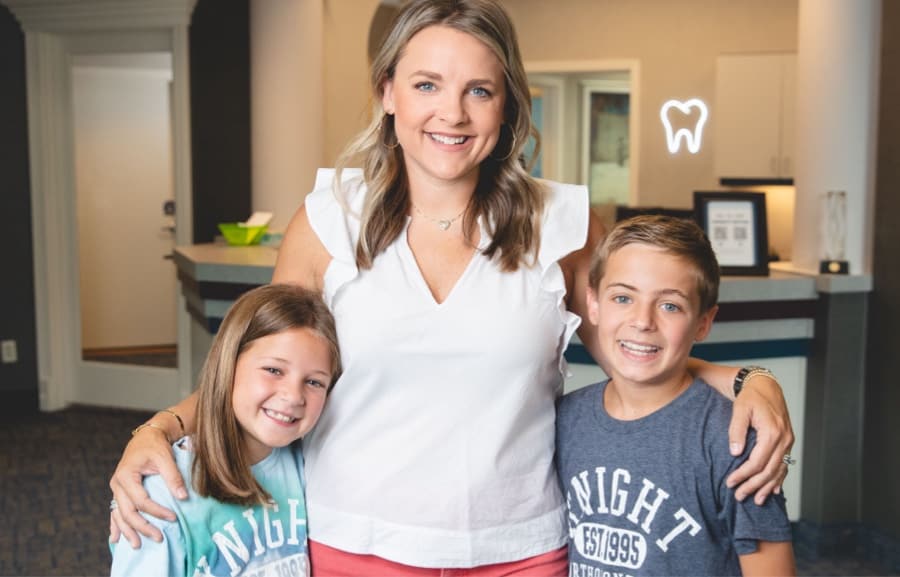 family smiling at office